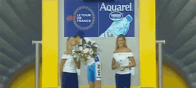 a man holding a bouquet of flowers in front of an aquarel sign