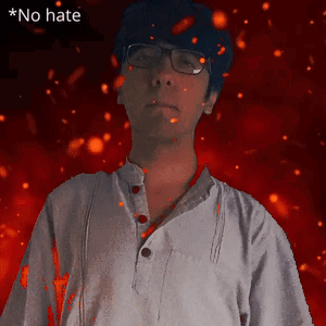 a man wearing glasses stands in front of a red background with the words  no hate  above him