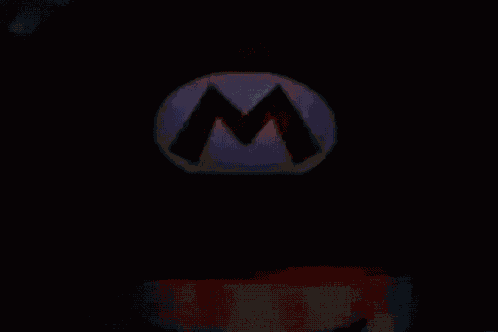 a close up of mario 's face with a red hat and blue eyes