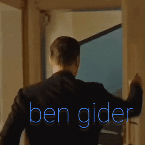a man in a suit is opening a door and the words ben gider are visible