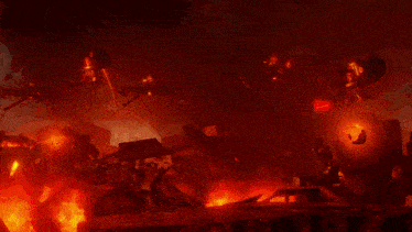 a blurred image of a fire with a red background