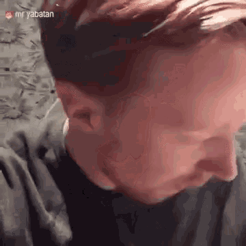 a close up of a man 's face with the words mr yabatan on the bottom right