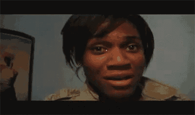 a close up of a woman 's face with the word bitch written above her