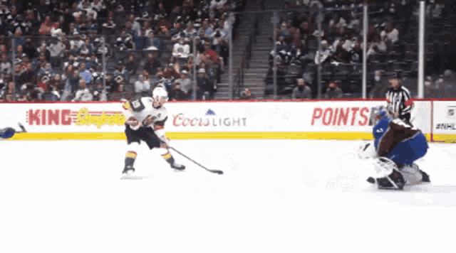 a hockey game sponsored by coors light and king 's super