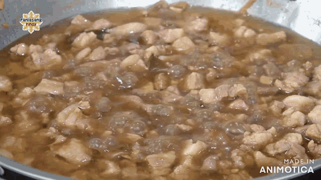 a pan of food with the words made in animotica on the bottom right