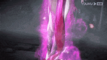 a close up of a person 's legs with pink flames coming out of them