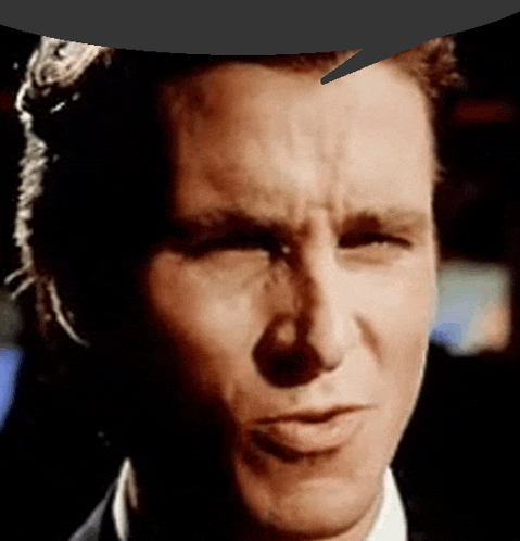a close up of a man 's face with a speech bubble above his head
