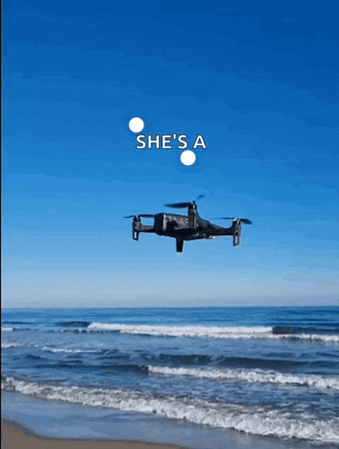 a drone is flying over the ocean with the words " she 's a " on the bottom