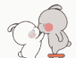 a couple of rabbits are kissing each other on the cheek .