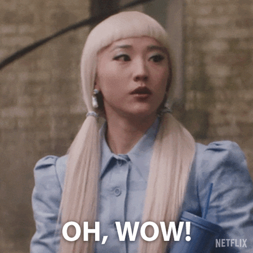 a woman with blonde hair is holding a cup and says oh wow