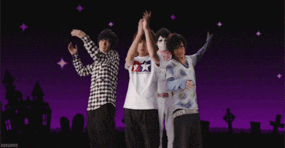 a group of people are hugging each other with a purple background and a white x3 on it