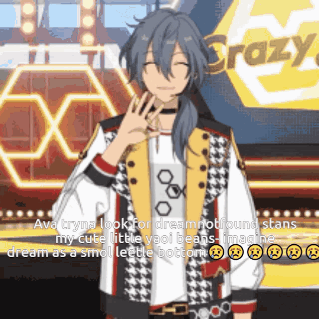 a man with long hair is standing in front of a stage .