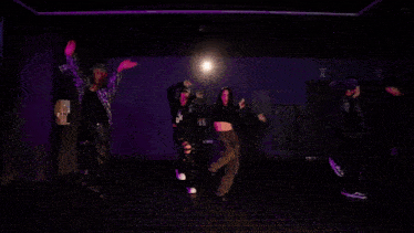 a man in a plaid shirt is being held by two men in black jackets