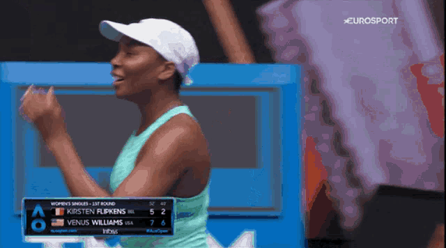 a woman in a white hat is on a eurosport screen