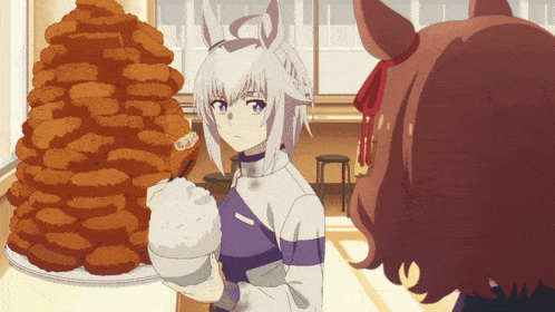 a girl holding a bowl of rice stands in front of a stack of fried food