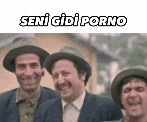 a group of men wearing hats are smiling and laughing .