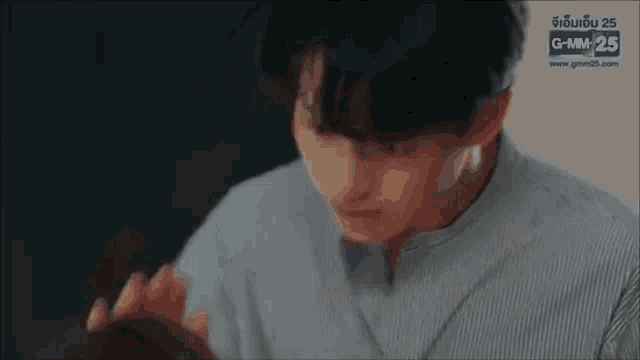 a man and a woman are touching each other 's faces in a room .