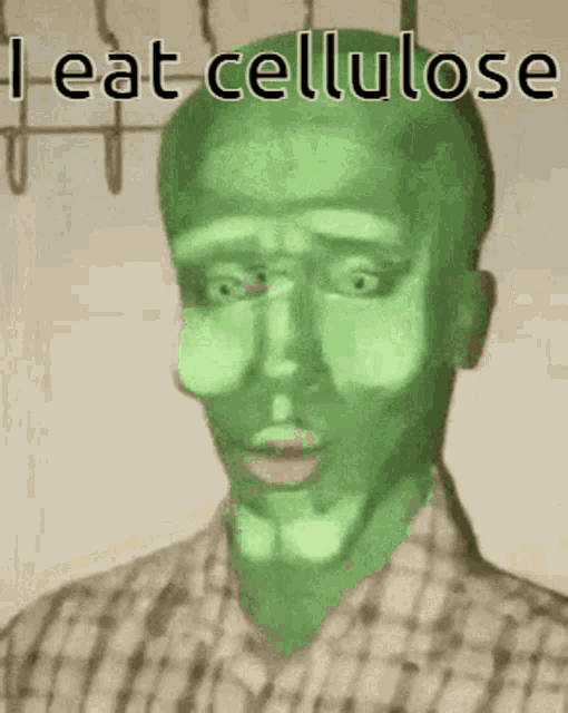a man with a green face and the words i eat cellulose