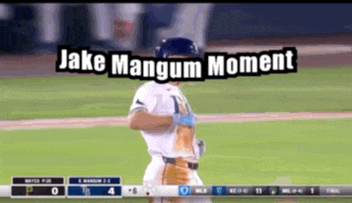 a baseball player with the words " jake mangum moment " on the bottom
