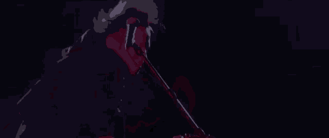 a man is playing a keyboard and singing into a microphone .