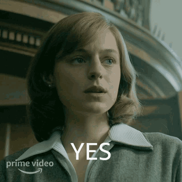 a close up of a woman 's face with the word yes written above her