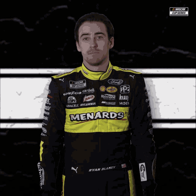 ryan blaney is wearing a black and yellow menards outfit