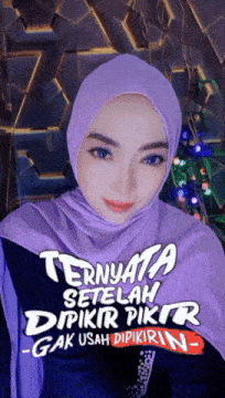a woman wearing a purple hijab with the words " ternyata setelah dipikir pikir -gak usah dipikirin "