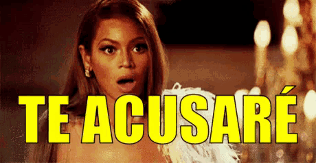 a woman with a surprised look on her face is standing in front of a yellow sign that says te acusare