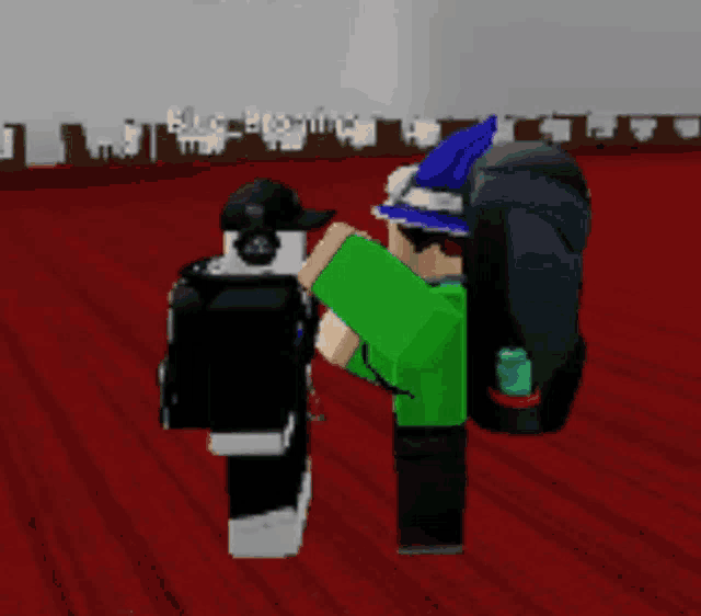 a person in a green shirt is holding a camera in a room
