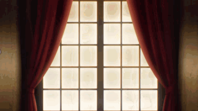 a window with red curtains and a light coming through it