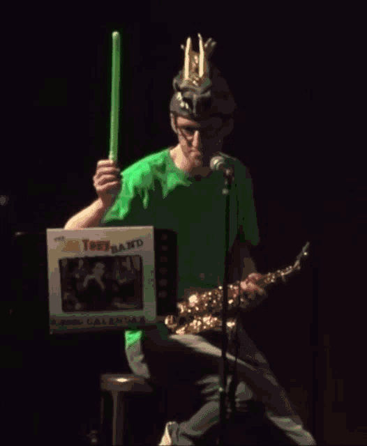 a man playing a saxophone in front of a box that says " bill tony band "