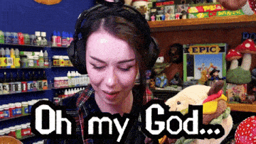 a woman wearing headphones says " oh my god "
