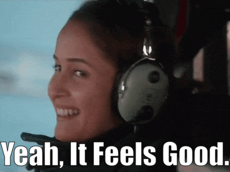 a woman wearing headphones with the words yeah it feels good on the bottom