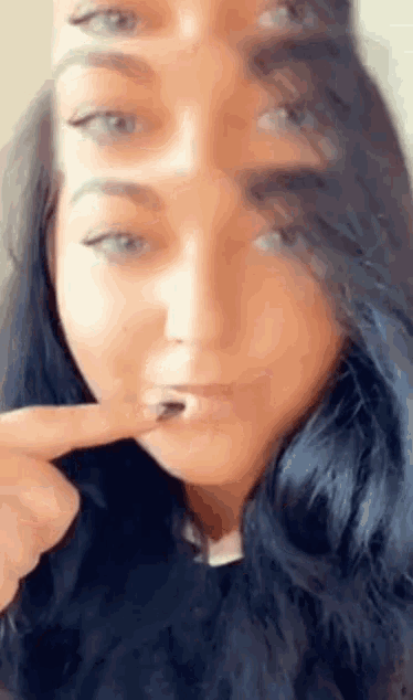 a close up of a woman 's face with three different images of her face .
