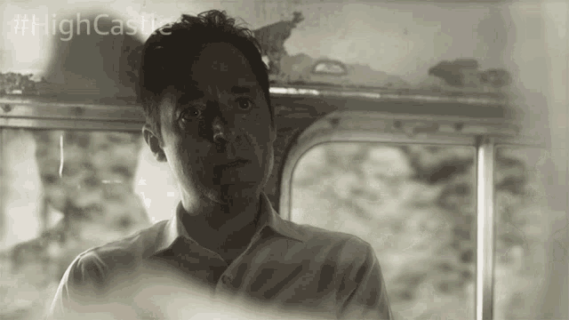 a black and white photo of a man with #highcastle on the bottom right