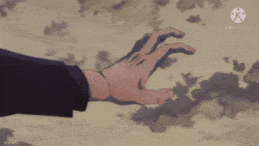 a person 's hand is reaching out towards another person 's arm in a scene from a video created by kinemaster