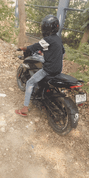 a person sitting on a motorcycle with a license plate that says ulf384y