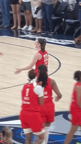 a female basketball player with the number 22 on her back