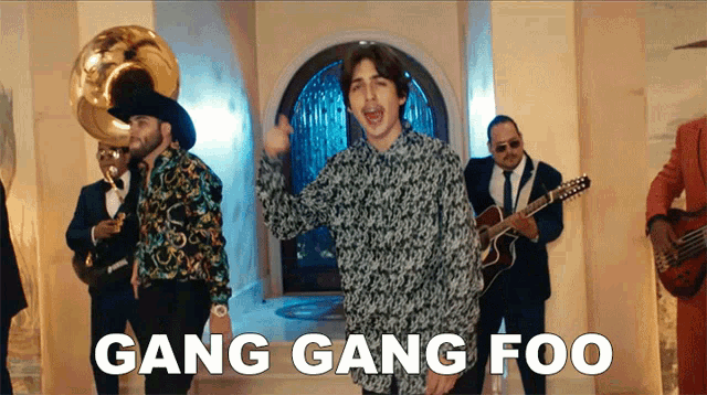 a group of men singing gang gang foo