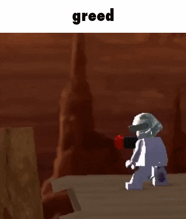 a cartoon character is standing on top of a wooden box with the word greed written above him .