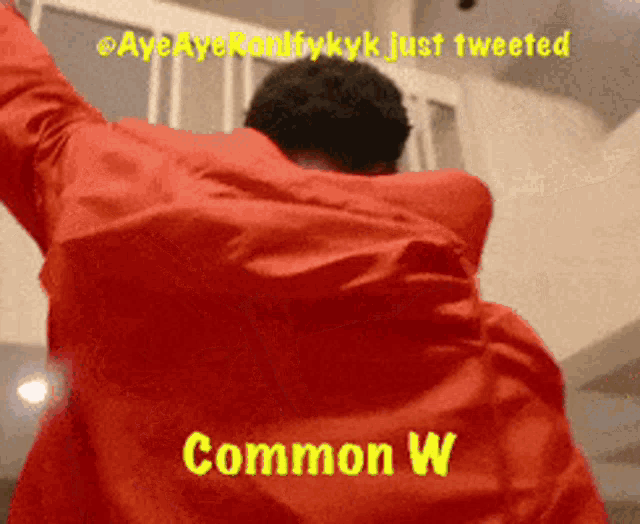 a man in a red jacket with the words " common w " on his back