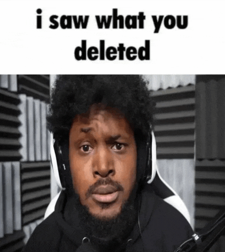 a man with a beard wearing headphones and a microphone says i saw what you deleted .