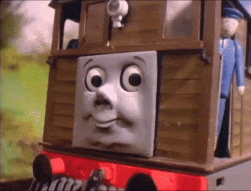 a cartoon train with a smiley face on it