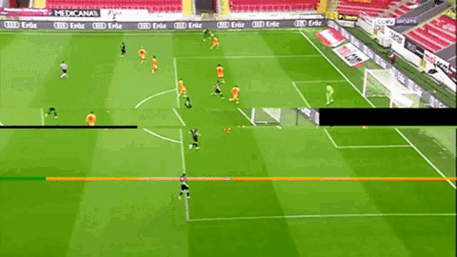 a soccer game is being played on a field with a green line between the players