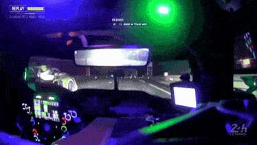 a replay of the 24 hours of le mans race is displayed on the screen