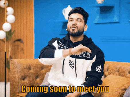 a man sitting on a couch with the words " coming soon to meet you " on the bottom