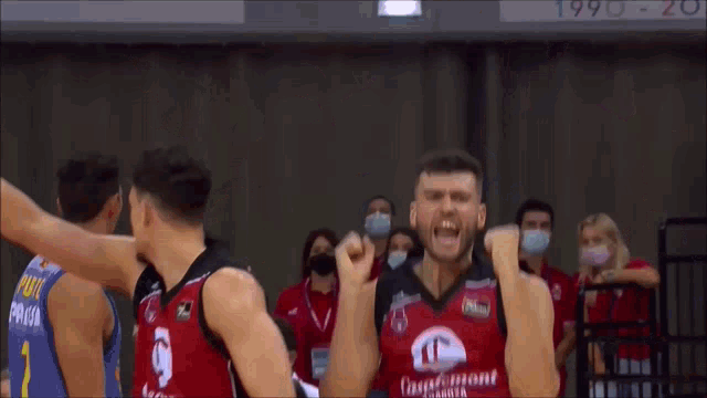 a basketball player wearing a red and black jersey that says baudpunt
