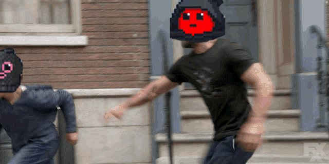 a man in a black shirt with a pixelated face on his head