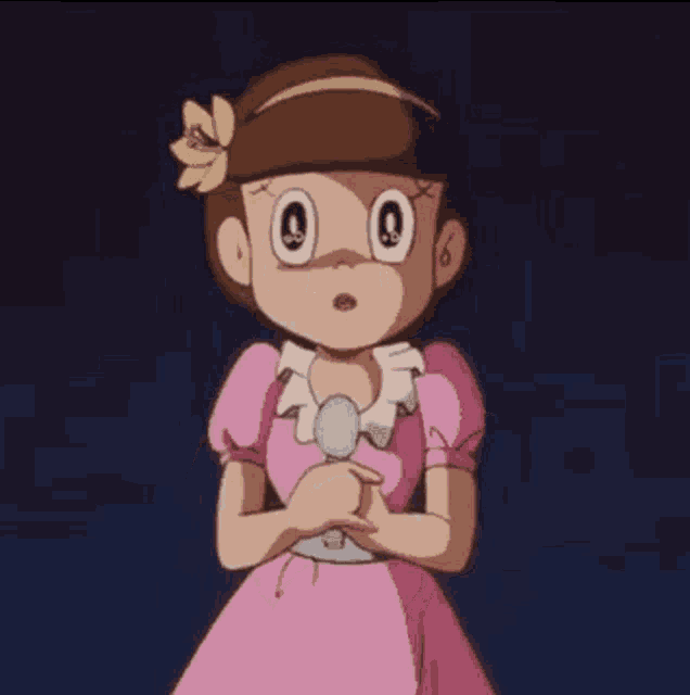 a girl in a pink dress with a flower in her hair
