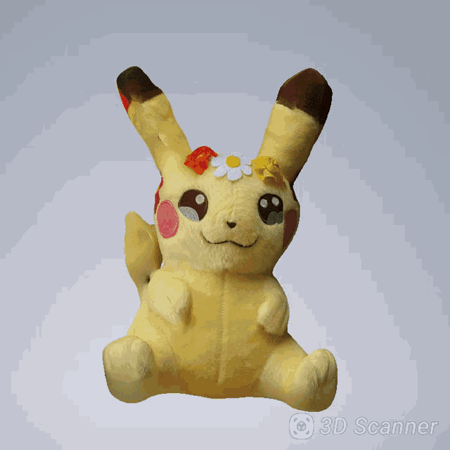 a stuffed animal with flowers on its back is being scanned by a 3d scanner app